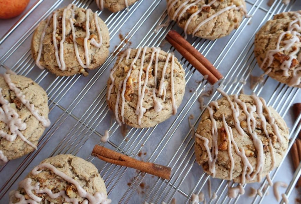 Apple Walnut Cookies rest on a baking sheet