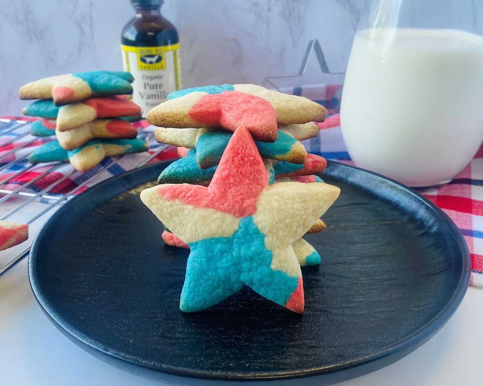 Red White and Blue Star Cookies stacked on a plate